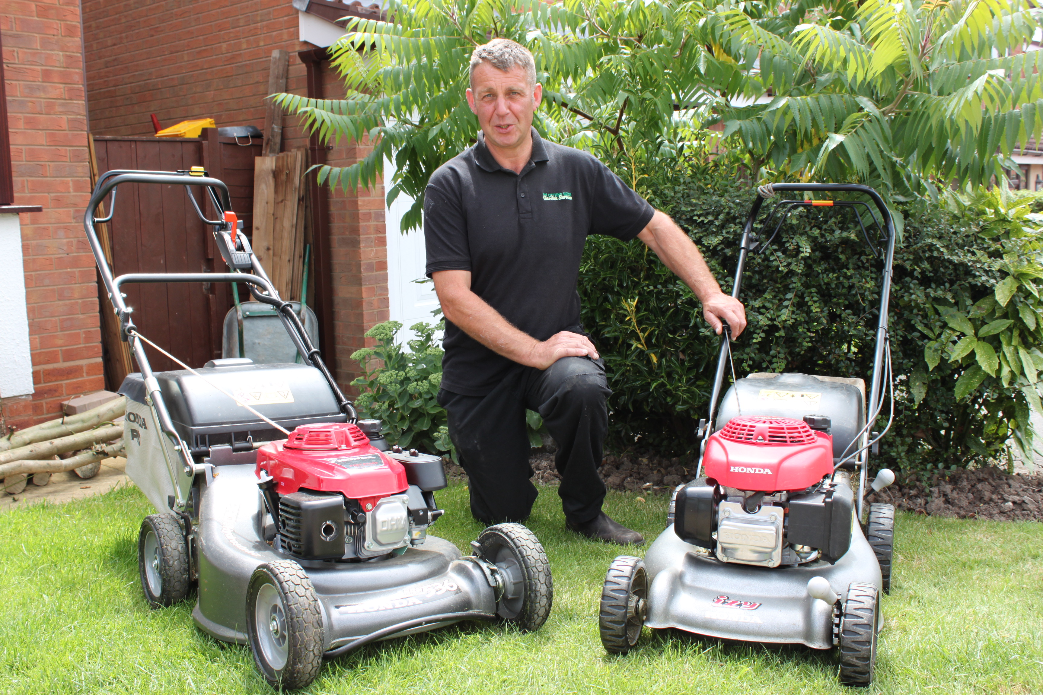 Photo of Dave with 2 lawnmowers from DM Cutting Hedge